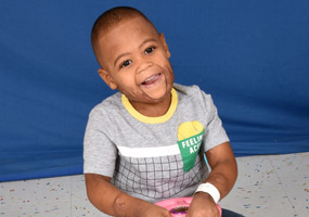 patient sitting on toy car