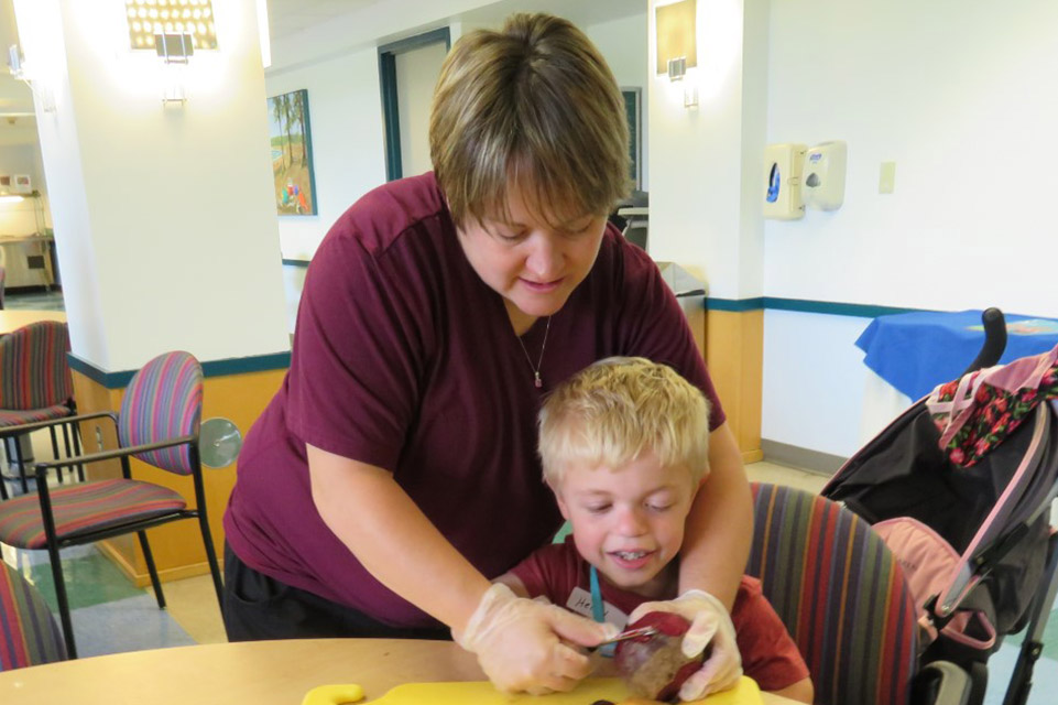 staff member helping patient