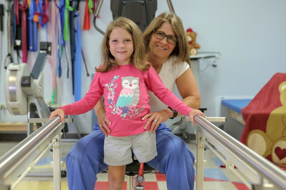 therapist working with patient during therapy session