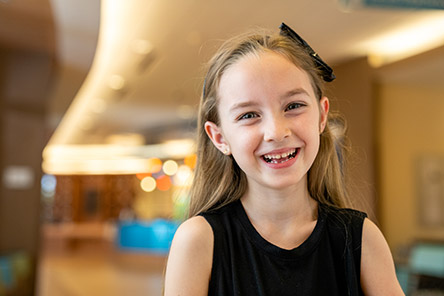 patient in lobby smiling