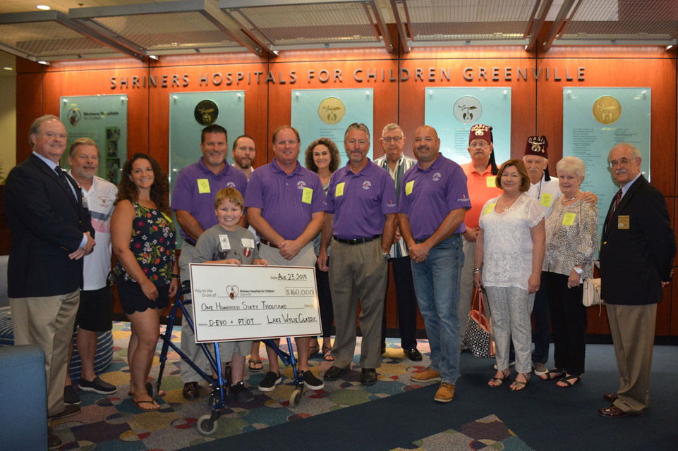 large group during giant check presentation