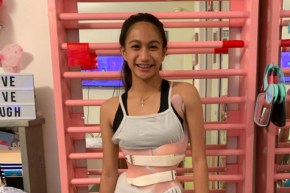 patient wearing scoliosis brace