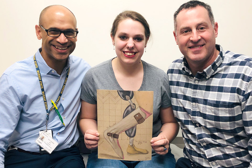 un patient avec deux membres du personnel