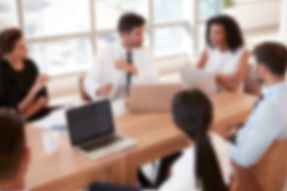 Medical staff sitting at meeting table