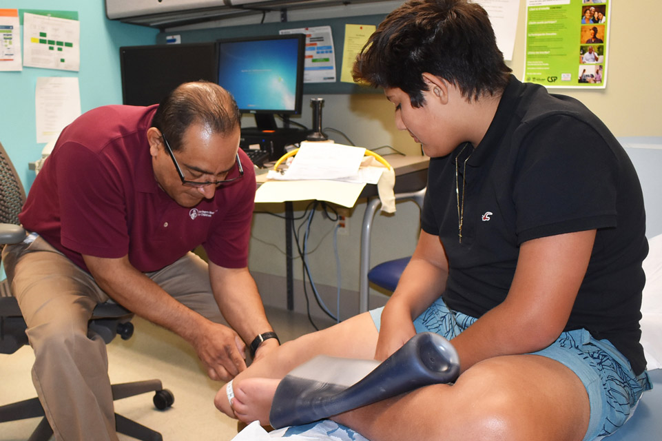 patient and physician treating leg