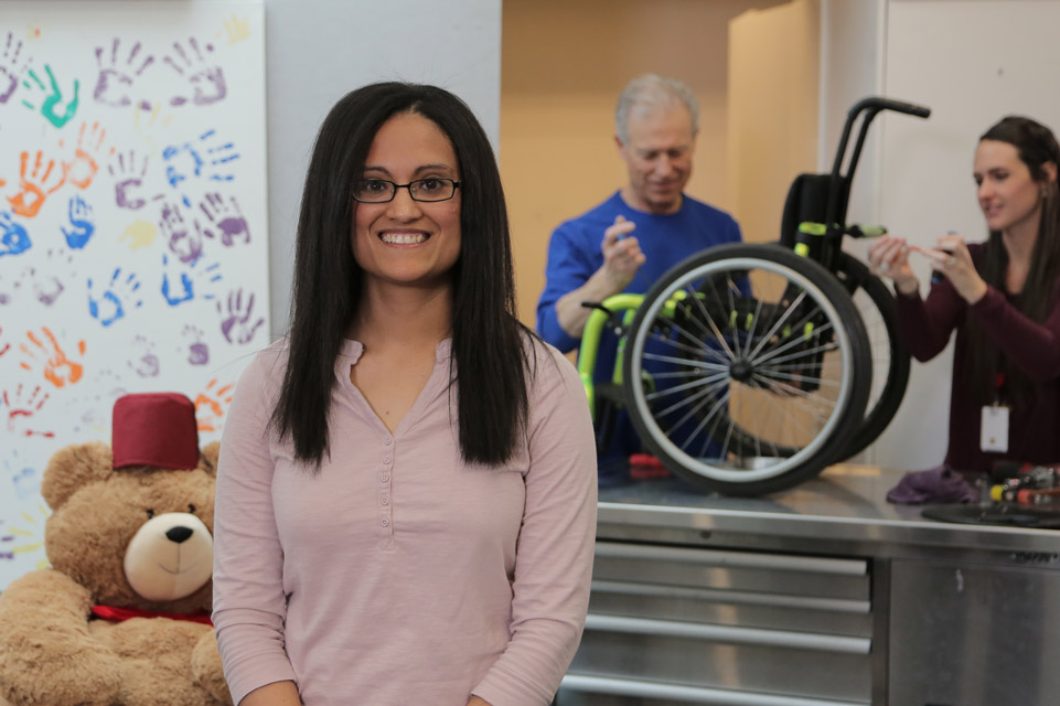 female staff member in wheelchair and seating department