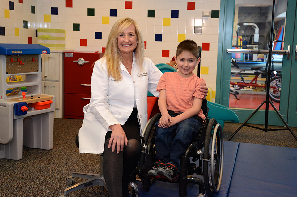 physician with patient in wheelchair