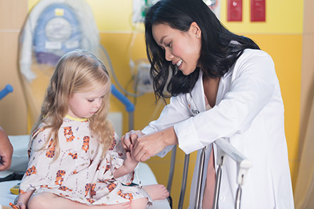 physician caring for female patient