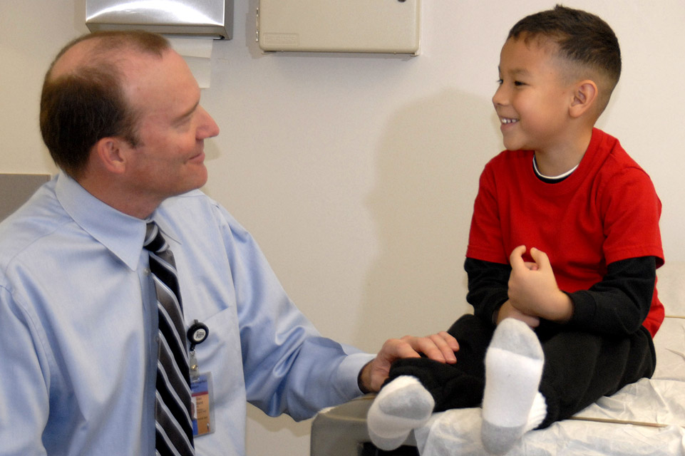 patient on exam table and physician