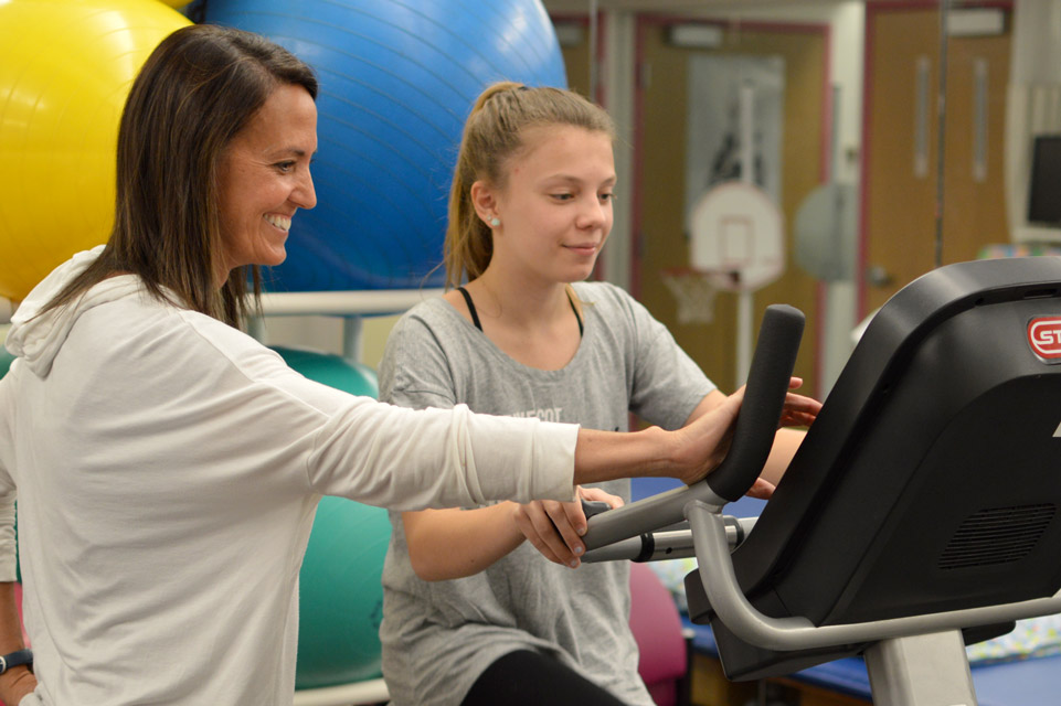 patient and staff member during physical therapy session