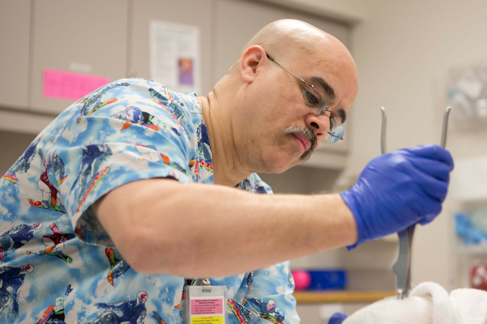 staff member working on prosthetic device