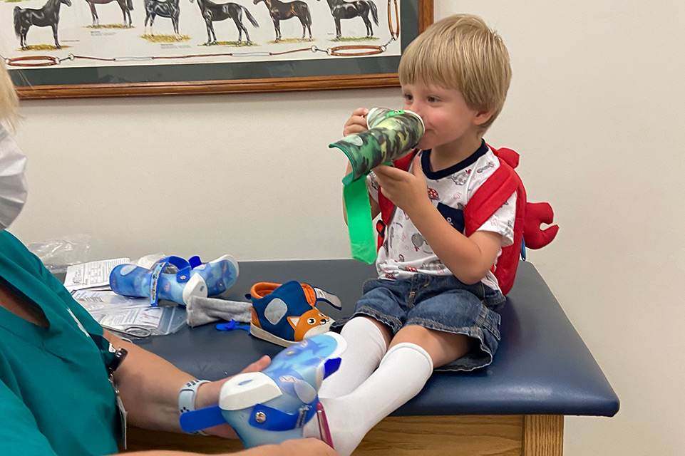 male clinic patient with orthotic devices