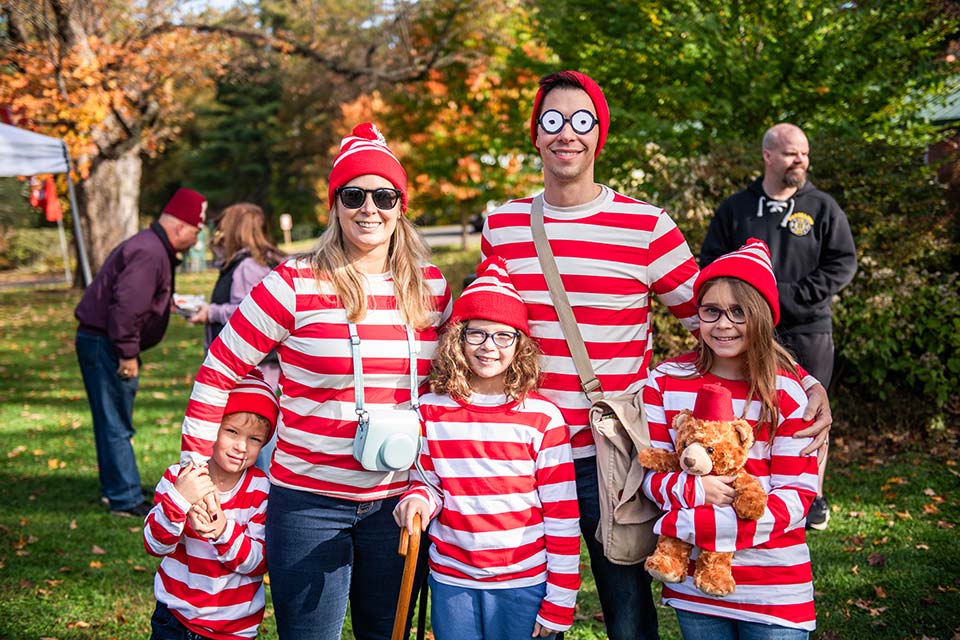 five family members dressed in costumes