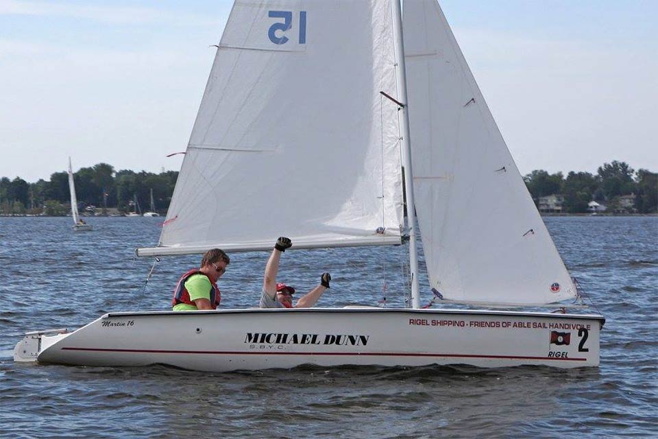 Richard on the boat with teammate...winning