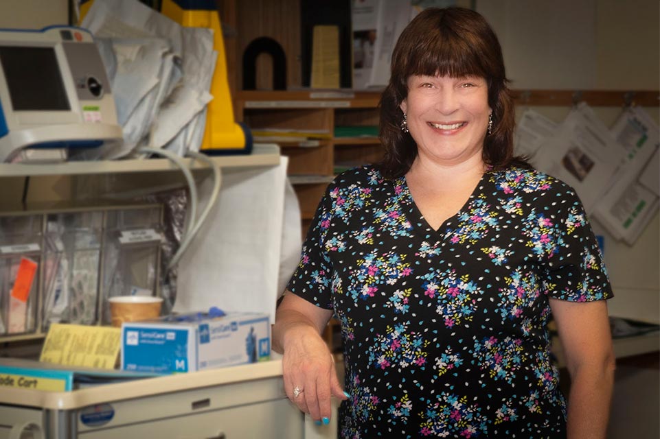 Lianne Albright standing by nurses station