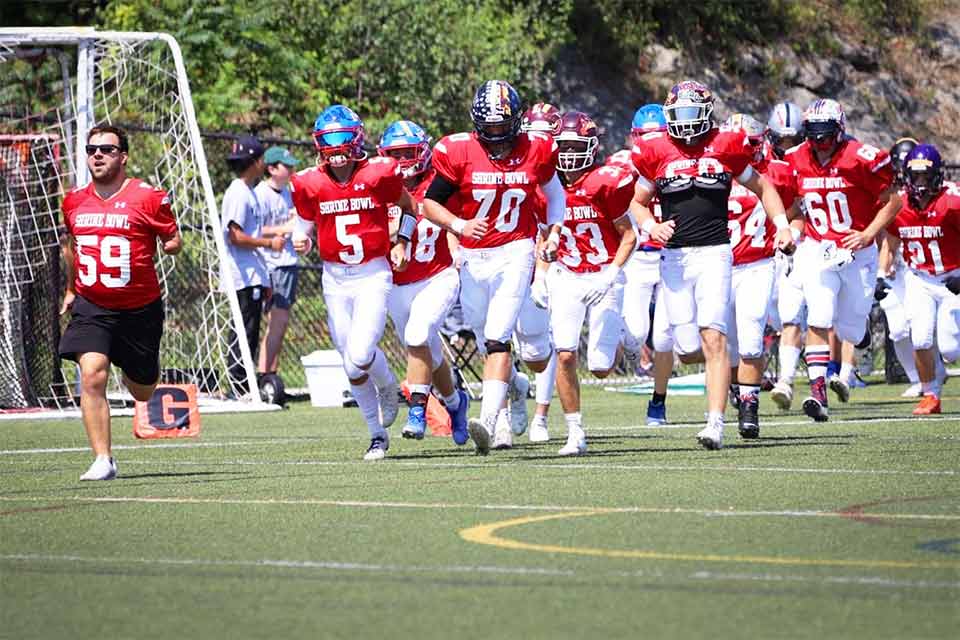 The team entering the field