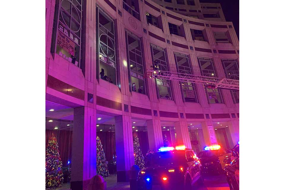 Police car and fire truck in front of hospital