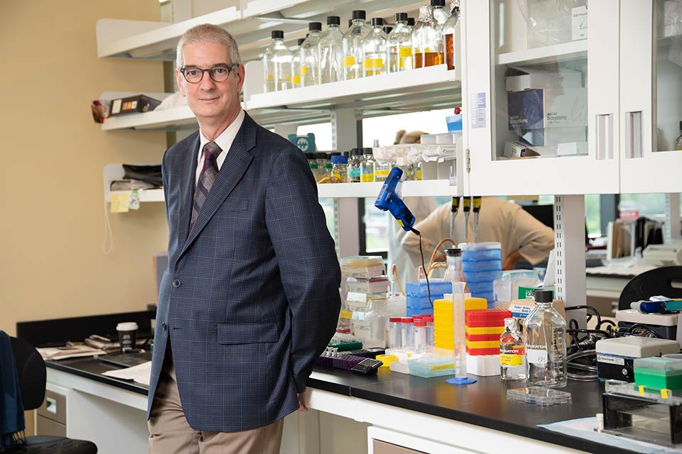 Dr. St. Arnaud in laboratory