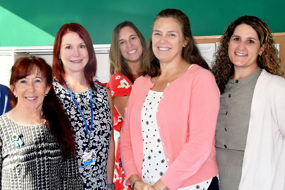 five female members of the care team