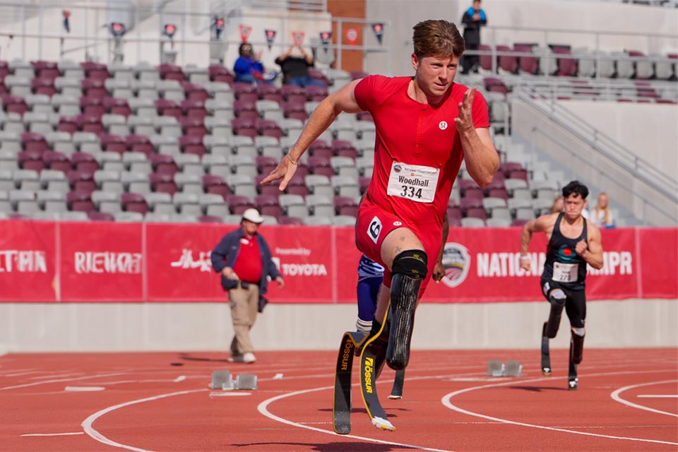 Hunter racing wearing prosthetic blades