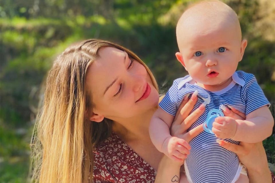 Kohen's mom holding him