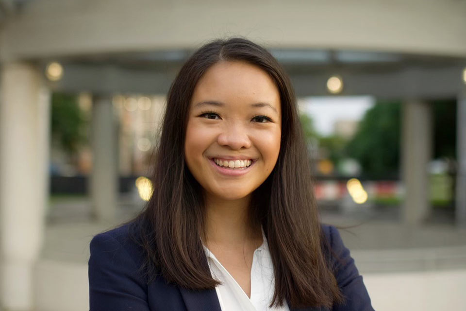 Emma in professional attire, smiling