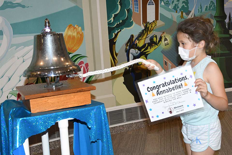 Annabelle ringing the bell during her last visit