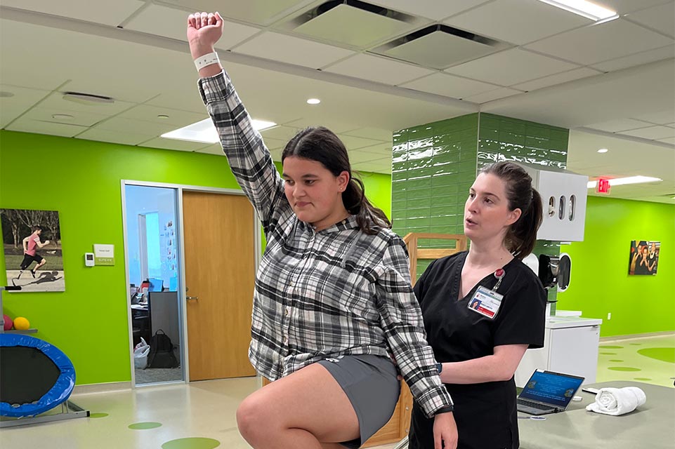 jaedin and physical therapist working on routine