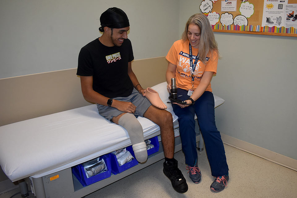 Enzo with prosthetic practitioner