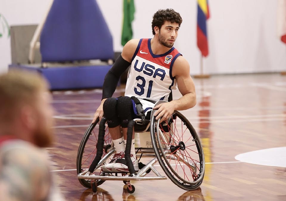 male wheelchair basketball player on court