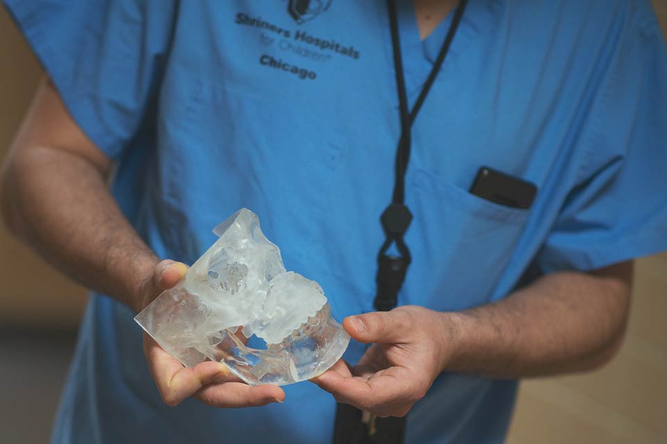 physician  holding jaw model