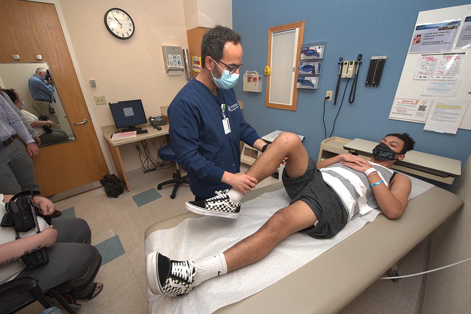 Dr. Bayomy working with patient