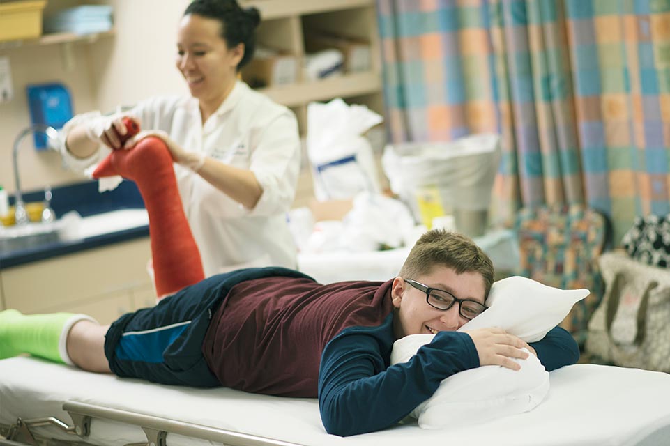 Provider and male patient during leg casting