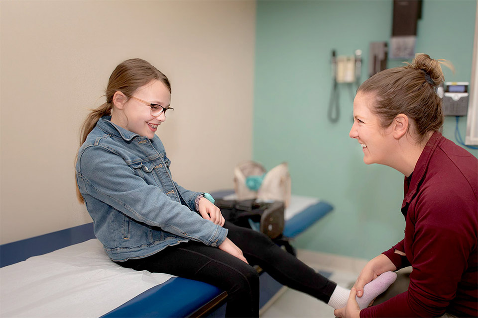 Female patient smiling with nurse