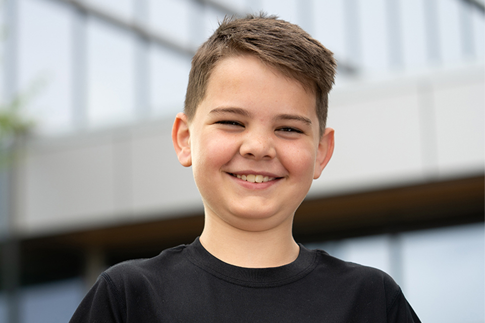 smiling patient outside hospital boy