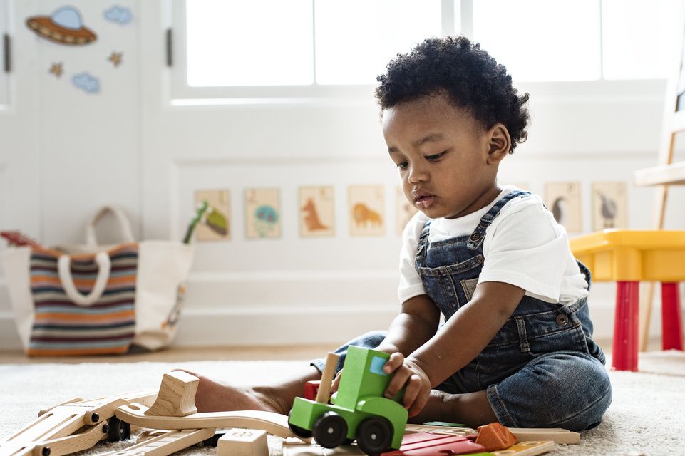 male patient playing with train set