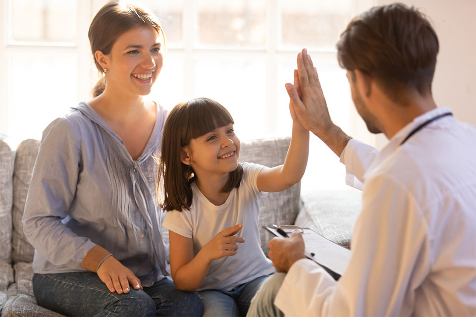 mother and female patient, physician high five