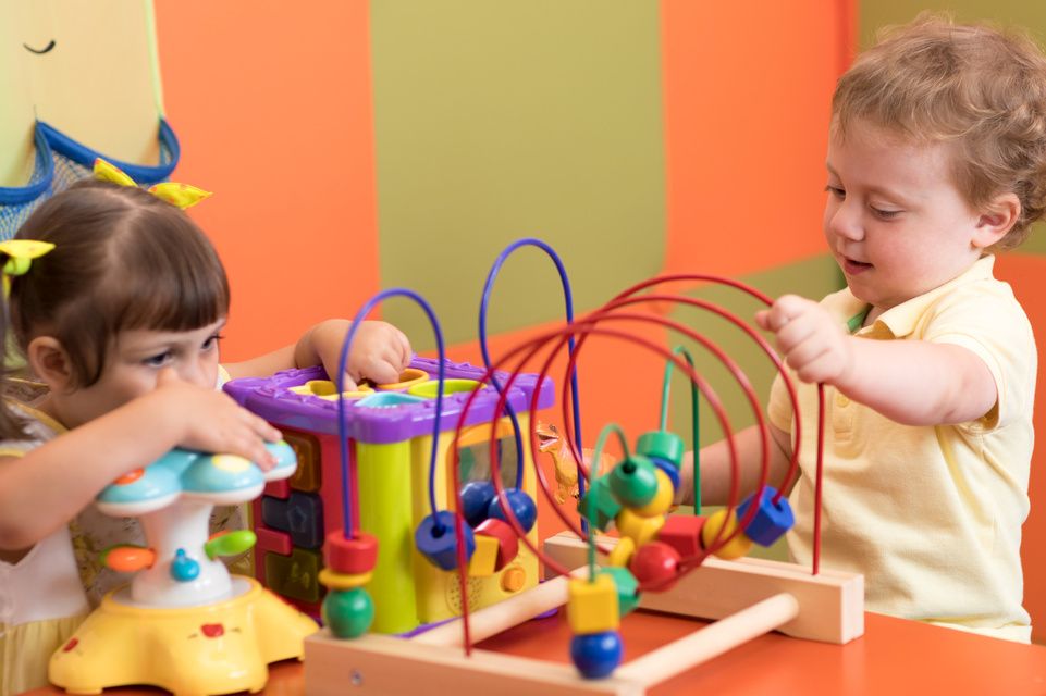 male and female patients playing with toys