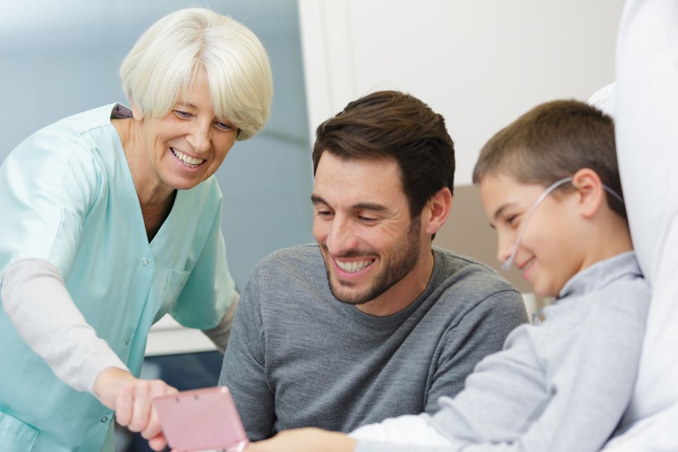 patient and father with nurse