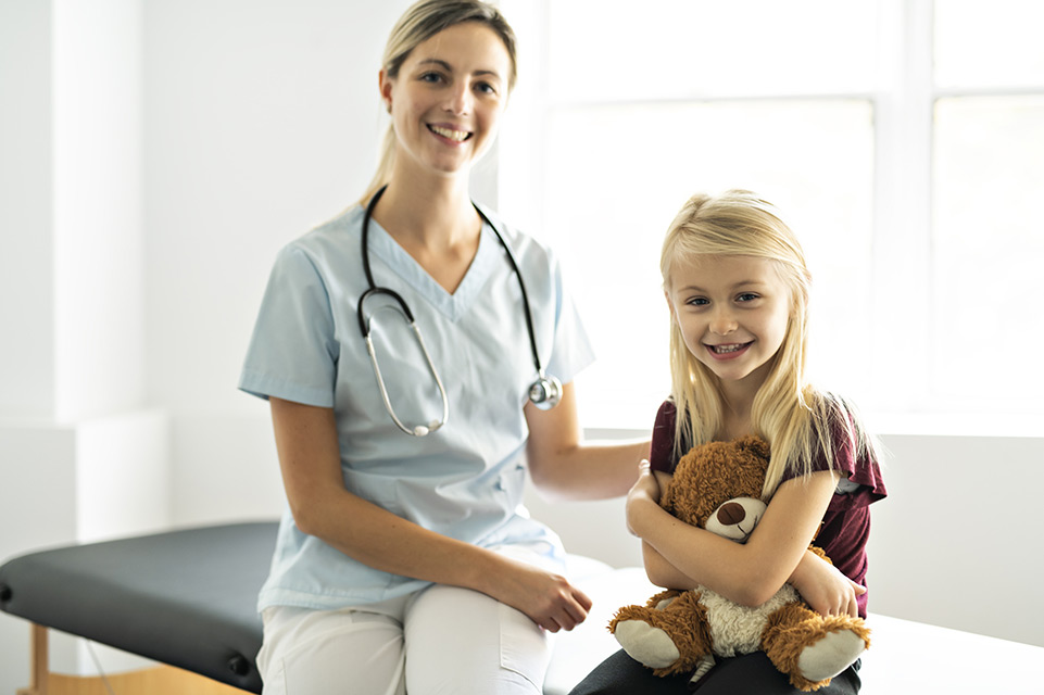 patient and nurse sitting on exam table