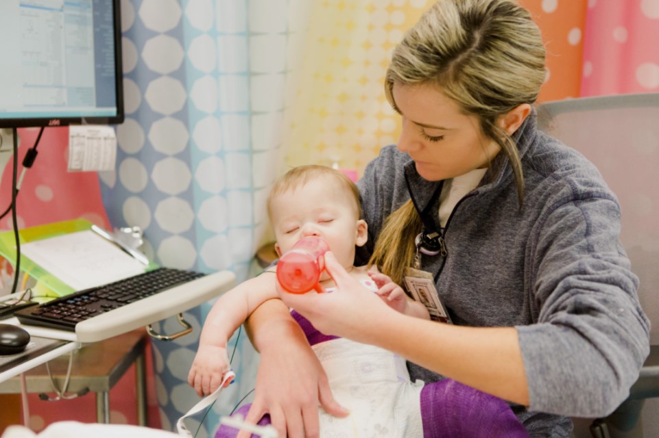 nurse holding baby