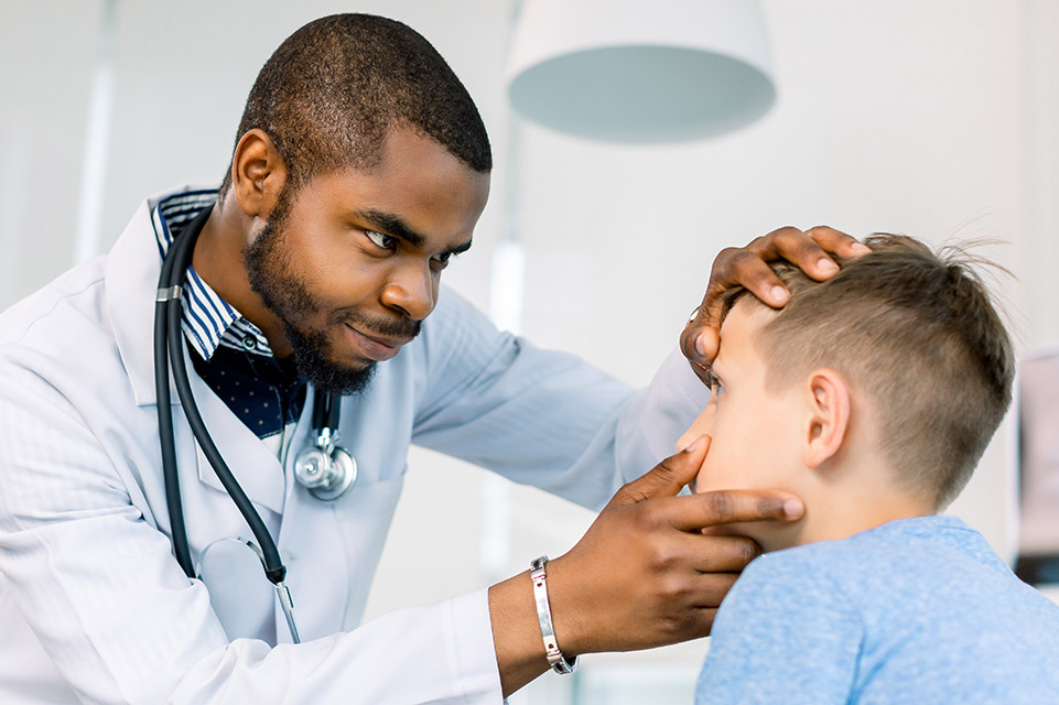 physician examines patient eye