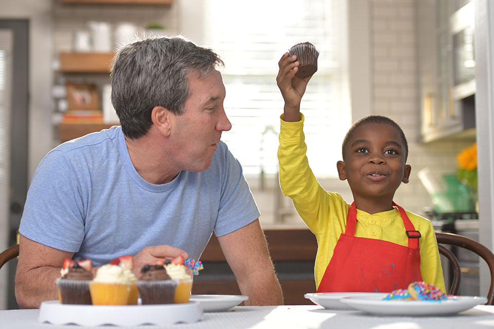 patient and father eating cupcakes