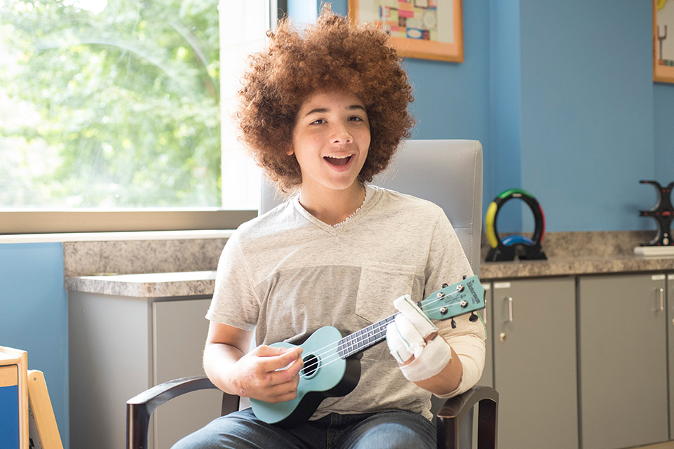 patient playing ukele