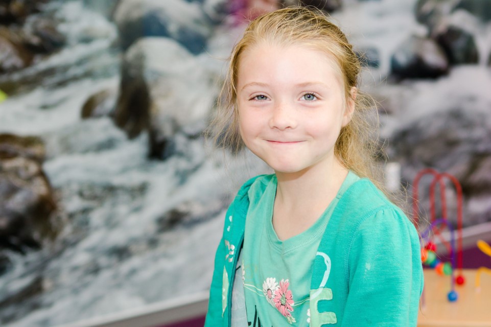 female patient outside, smiling