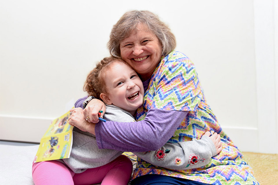 Patient and staff sharing a hug.