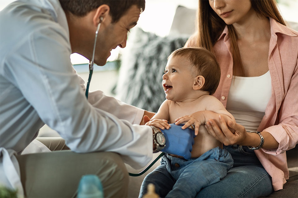 mother holding baby, physician