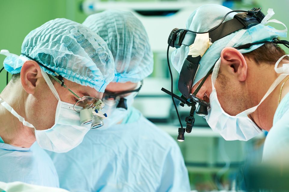 three male surgeons during surgery