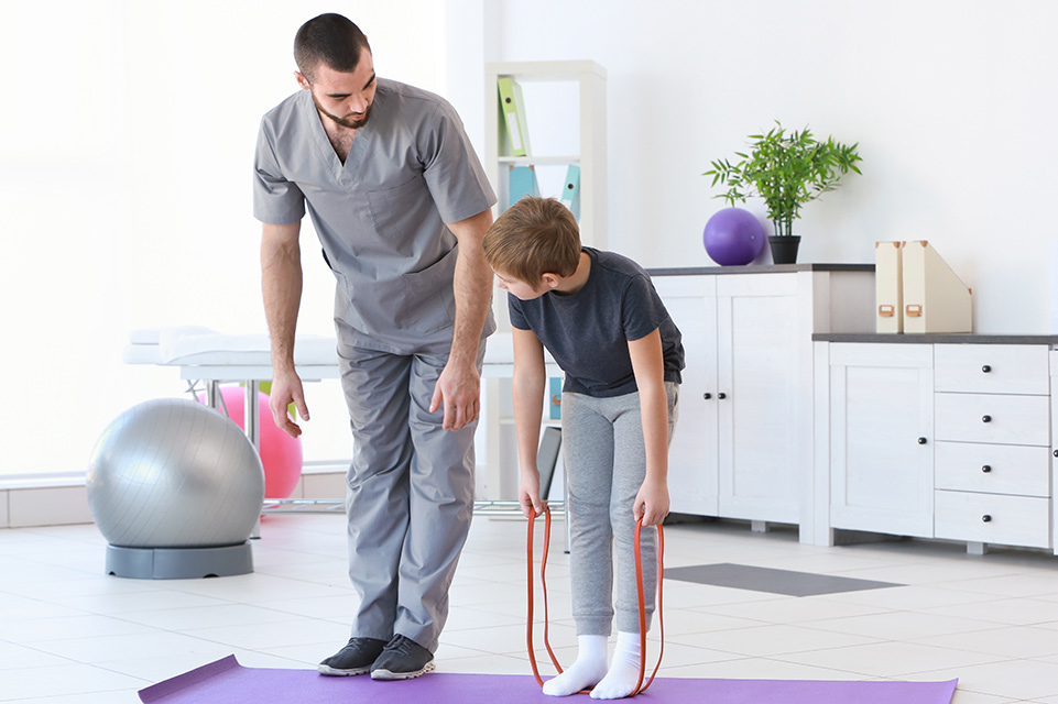 therapist and patient stretching