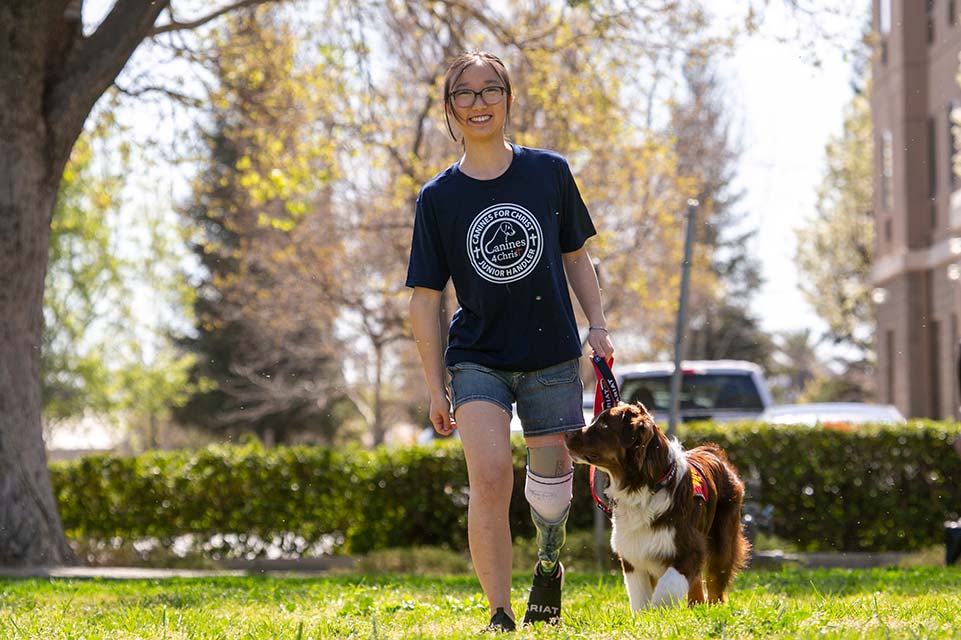 Kaysie Li walking dog in park